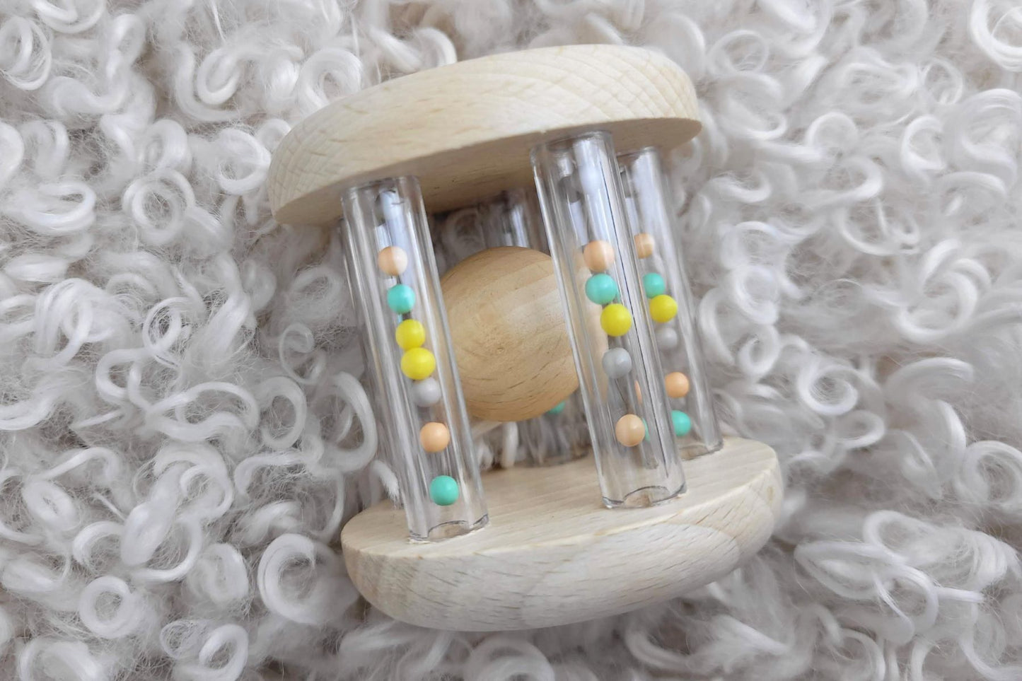 CALM & BREEZY WOODEN RATTLE WITH RAINBOW BEAD